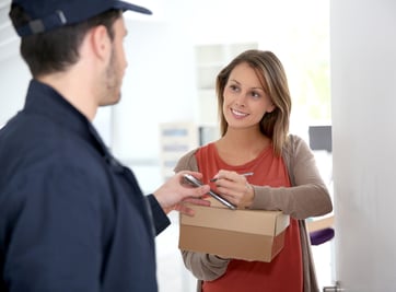 Woman sigining electronic receipt of delivered package-1