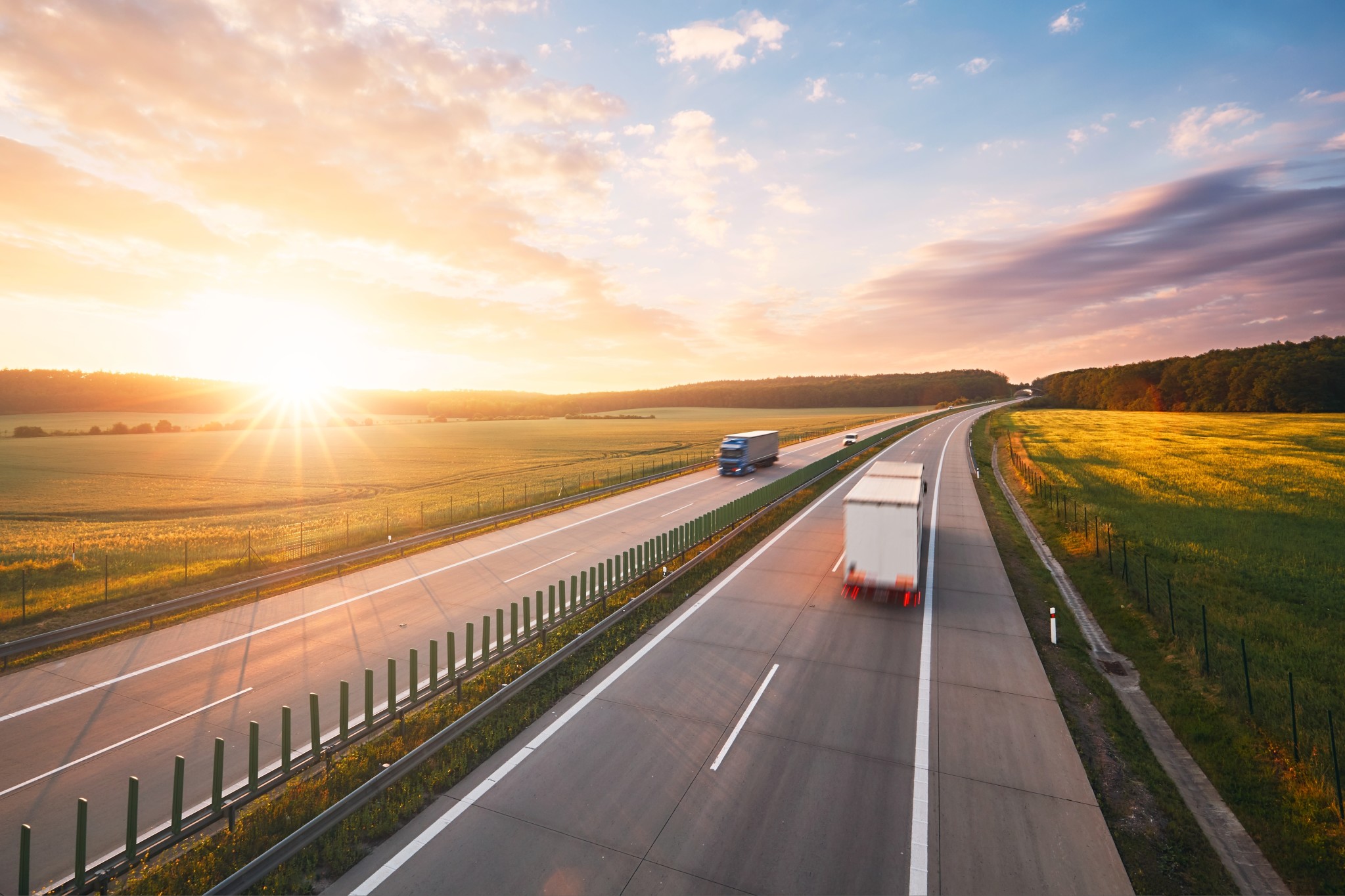 amazing-sunrise-on-the-highway-in-the-middle-of-the-countryside-transportation-and-cars-theme_t20_6w1JmO